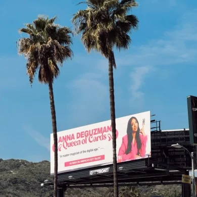 Anna DeGuzman billboard featuring Queen of Cards and As Seen On America's Got Talent branding framed by palm trees